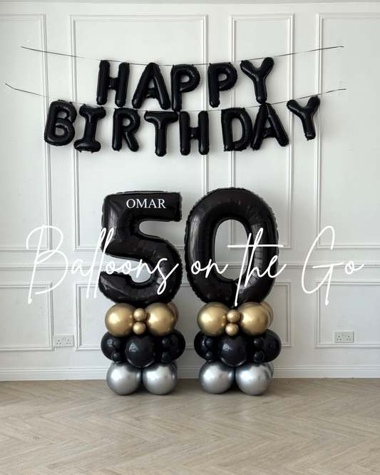 HBD banner with number balloon towers