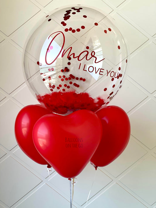 Customized bubble balloon with feathers and confetti