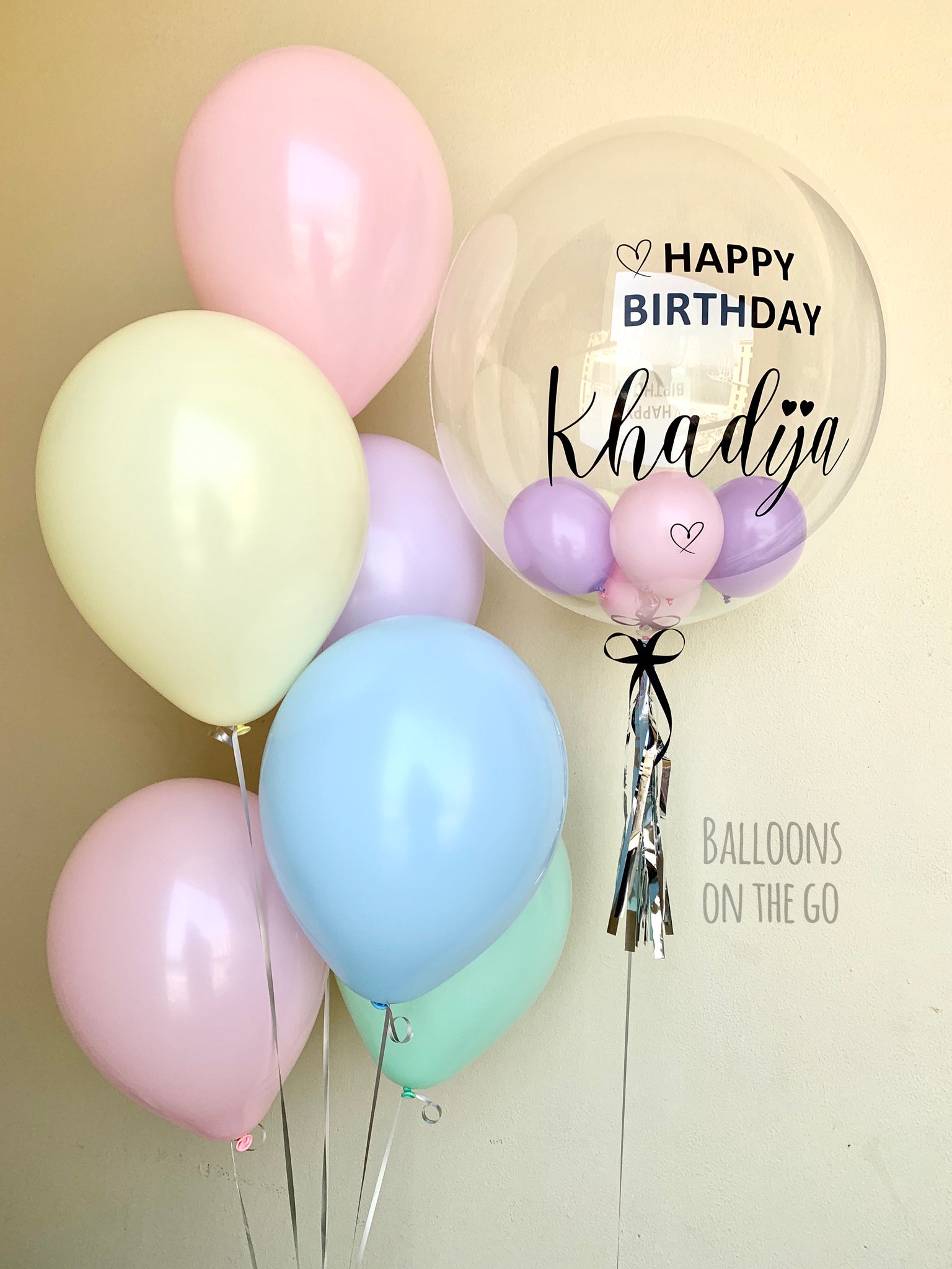 Customized bubble balloon with pastel bouquet